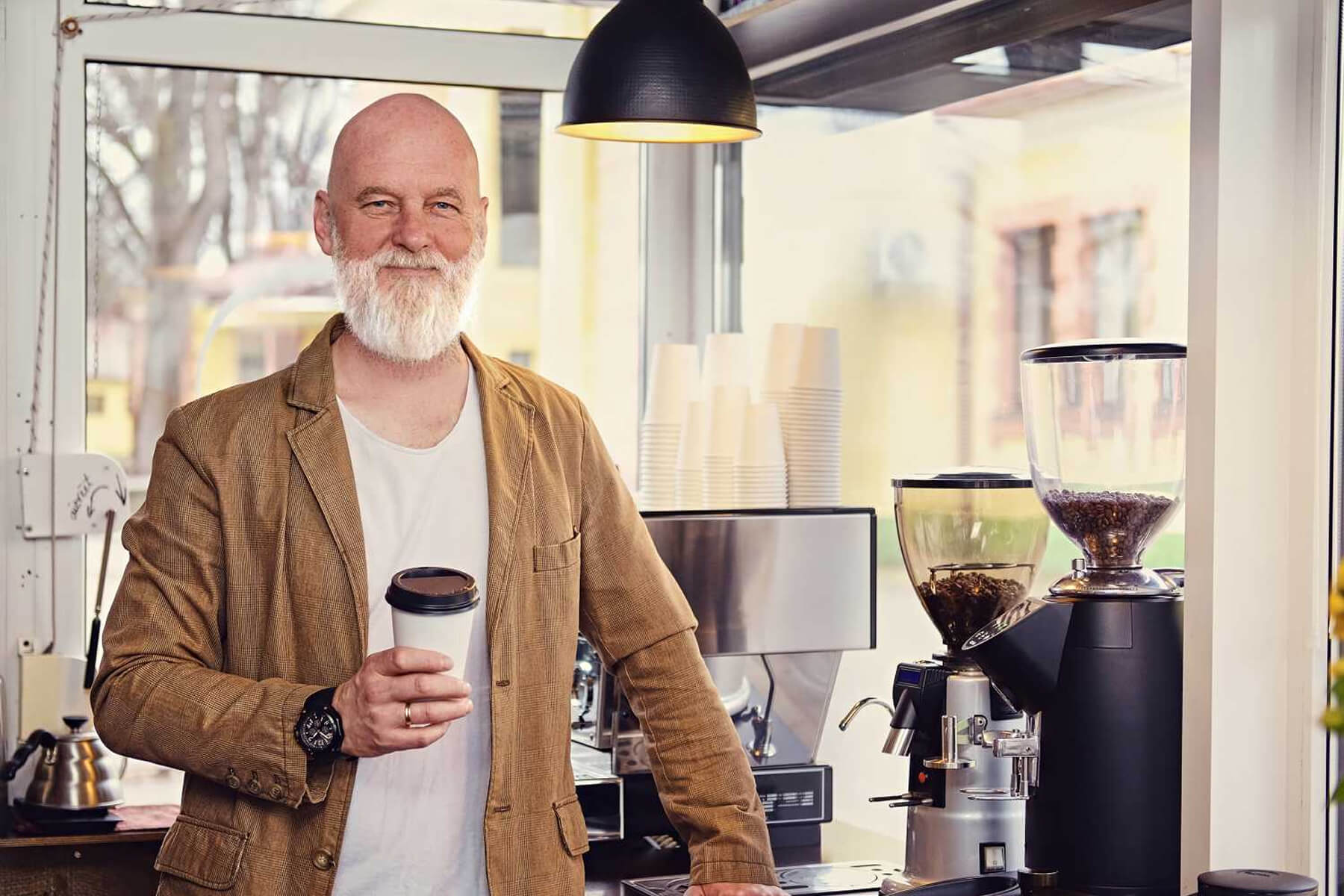 joyful-old-man-barista-dressed-in-casual-clothes-ZX2Z6F2