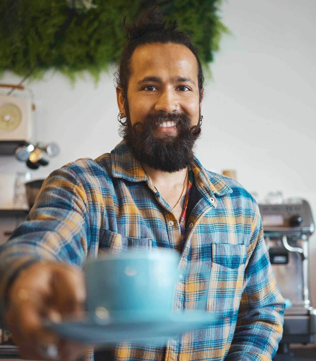 cafe-portrait-and-man-barista-with-a-coffee-for-a--9EAYZC3