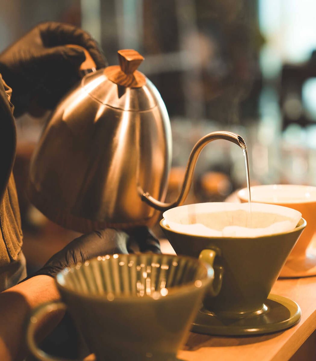 hipster-barista-making-a-drink-coffee-with-drip-or-QH9GKFB